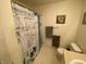 Bathroom features a stylish shower curtain and convenient towel racks for a comfortable experience at 1348 Mccormicks Cir, Danville, IN 46122