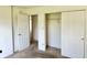 Carpeted bedroom features closet with sliding doors at 1348 Mccormicks Cir, Danville, IN 46122