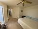 Bedroom with neutral walls, ceiling fan, and carpeting offers a comfortable and quiet space at 1348 Mccormicks Cir, Danville, IN 46122
