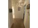 Neutral hallway with art and access to bathroom, bedroom, and other rooms at 1348 Mccormicks Cir, Danville, IN 46122