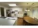 Well-lit kitchen with white cabinetry, modern appliances, and an adjacent dining area for easy meals at 1348 Mccormicks Cir, Danville, IN 46122