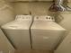 Convenient laundry room features a side-by-side washer and dryer for efficient chores at 1348 Mccormicks Cir, Danville, IN 46122