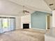 Spacious living room boasts a fireplace and large sliding glass doors providing natural light at 1348 Mccormicks Cir, Danville, IN 46122