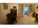 Cozy room with wicker chair, cabinet, and sliding glass doors offering a view of the patio at 1348 Mccormicks Cir, Danville, IN 46122