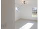 Spacious basement room with large window and neutral decor at 1523 Marlowe Ave, Indianapolis, IN 46201