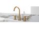 Modern bathroom sink with gold faucet and white quartz countertop at 1523 Marlowe Ave, Indianapolis, IN 46201