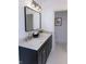 Modern bathroom with a double vanity, quartz countertop, and gold fixtures at 1523 Marlowe Ave, Indianapolis, IN 46201