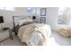 Bright bedroom with a queen bed, ample natural light, and stylish decor at 1523 Marlowe Ave, Indianapolis, IN 46201