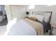 Bright bedroom with a queen-size bed, nightstands, and a sliding door closet at 1523 Marlowe Ave, Indianapolis, IN 46201