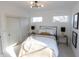 Bright bedroom with a queen bed, ample natural light, and stylish decor at 1523 Marlowe Ave, Indianapolis, IN 46201