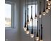 Modern chandelier with teardrop glass pendants adds a touch of elegance at 1523 Marlowe Ave, Indianapolis, IN 46201