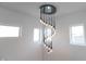 Elegant spiral chandelier with crystal accents illuminates the staircase at 1523 Marlowe Ave, Indianapolis, IN 46201