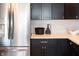Modern kitchen features stainless steel appliances and white herringbone backsplash at 1523 Marlowe Ave, Indianapolis, IN 46201