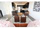 Modern kitchen with dark cabinetry, stainless steel appliances, and a quartz countertop at 1523 Marlowe Ave, Indianapolis, IN 46201