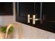 Close up of gold handles on dark kitchen cabinets at 1523 Marlowe Ave, Indianapolis, IN 46201