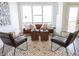 Living area with a brown velvet couch, two armchairs, and a large window at 1523 Marlowe Ave, Indianapolis, IN 46201