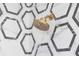 Close-up of a modern gold shower head with hexagonal tile surround at 1523 Marlowe Ave, Indianapolis, IN 46201