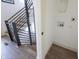 Modern staircase with black metal railing and light wood steps at 1523 Marlowe Ave, Indianapolis, IN 46201