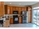 Kitchen with wood cabinets, stainless steel appliances, and a breakfast bar at 15314 Mystic Rock Dr, Carmel, IN 46033