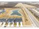 Aerial view of neighborhood with pond and road at 16930 Cole Evans Dr, Noblesville, IN 46060