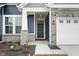 Front entry with stone pillars and dark-stained door at 16930 Cole Evans Dr, Noblesville, IN 46060