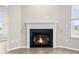 Modern corner fireplace with white mantel at 16930 Cole Evans Dr, Noblesville, IN 46060