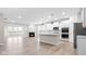 Open concept kitchen with white cabinets and island at 16930 Cole Evans Dr, Noblesville, IN 46060
