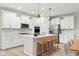 Modern kitchen with white cabinets and island at 16930 Cole Evans Dr, Noblesville, IN 46060