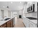 Modern kitchen with white cabinets, stainless steel appliances and island at 16930 Cole Evans Dr, Noblesville, IN 46060