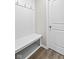 Laundry room with bench, hooks, and built-in shelving at 16930 Cole Evans Dr, Noblesville, IN 46060