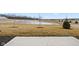 Community pond with grassy areas and landscaping at 16930 Cole Evans Dr, Noblesville, IN 46060
