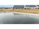 Frozen pond with a view of homes at 16930 Cole Evans Dr, Noblesville, IN 46060