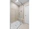 Large walk-in shower with tiled walls and a built-in seat at 16930 Cole Evans Dr, Noblesville, IN 46060