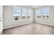 Bright sunroom with ample natural light and wood-look flooring at 16930 Cole Evans Dr, Noblesville, IN 46060