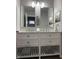 Bright bathroom featuring double vanity with white cabinets and marble countertop at 2426 S Holt S Rd, Indianapolis, IN 46241