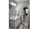 Elegant bathroom features a stylish vanity, ample lighting, and modern fixtures at 2426 S Holt S Rd, Indianapolis, IN 46241
