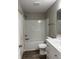 Clean bathroom featuring a shower-tub, toilet, and white vanity with silver hardware at 2426 S Holt S Rd, Indianapolis, IN 46241
