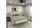 Comfortable bedroom featuring a ceiling fan, neutral color scheme, and ample natural light at 2426 S Holt S Rd, Indianapolis, IN 46241