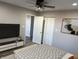 Comfortable bedroom features a ceiling fan, neutral color scheme, and ample closet space at 2426 S Holt S Rd, Indianapolis, IN 46241