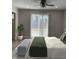 Bedroom with sliding glass doors, ceiling fan, and hardwood floors at 2426 S Holt S Rd, Indianapolis, IN 46241