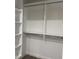 Spacious walk-in closet featuring adjustable shelving and hanging rods for organization at 2426 S Holt S Rd, Indianapolis, IN 46241