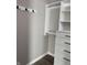 Closet space with black hardware and built-in shelving at 2426 S Holt S Rd, Indianapolis, IN 46241