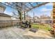 A spacious back deck features a wooden pergola, a built in grill station, and plenty of room for entertaining at 3356 N Park Ave, Indianapolis, IN 46205