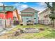 This backyard is equipped with a firepit, garden, small porch, and grilling station at 3356 N Park Ave, Indianapolis, IN 46205