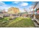 The backyard features a cozy brick fire pit and garden beds, perfect for outdoor gatherings and enjoying the natural surroundings at 3356 N Park Ave, Indianapolis, IN 46205