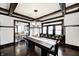 Bright dining room with a large window, wood floors, chandelier, and a table with room to sit at 3356 N Park Ave, Indianapolis, IN 46205