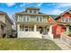 Traditional home with a well-kept lawn, a classic design, and a welcoming front entrance, ideal for a Gathering or those who like to host at 3356 N Park Ave, Indianapolis, IN 46205