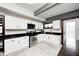 Efficient kitchen with stainless steel appliances, white cabinetry, and black countertops at 3356 N Park Ave, Indianapolis, IN 46205