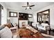 Stylish living room with a decorative fireplace, leather sofa, and unique wood coffee table at 3356 N Park Ave, Indianapolis, IN 46205