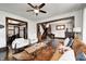 Comfortable living room with two chairs, a couch, wooden coffee table, and an open staircase at 3356 N Park Ave, Indianapolis, IN 46205